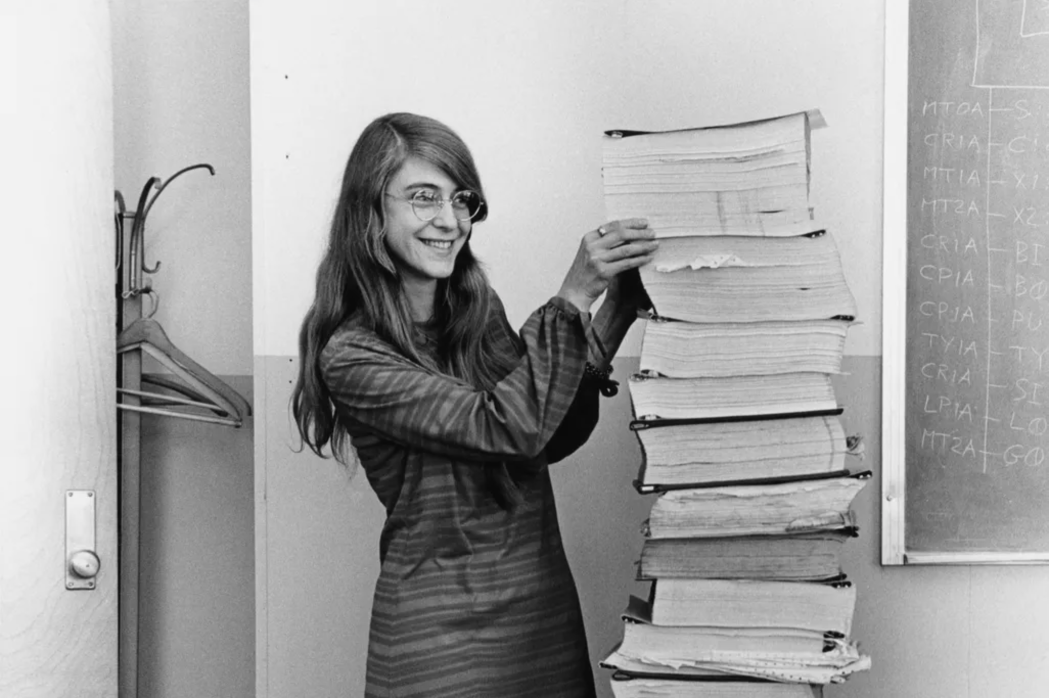 Computer scientist Margaret Hamilton poses with the Apollo guidance software she and her team developed at MIT